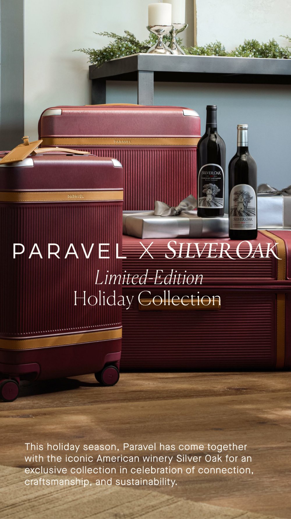 PARAVEL × SILVER OAK Limited-Edition Holiday Collection: oxblood ribbed Aviator cases with cognac trim beside two bottles of Silver Oak Cabernet.